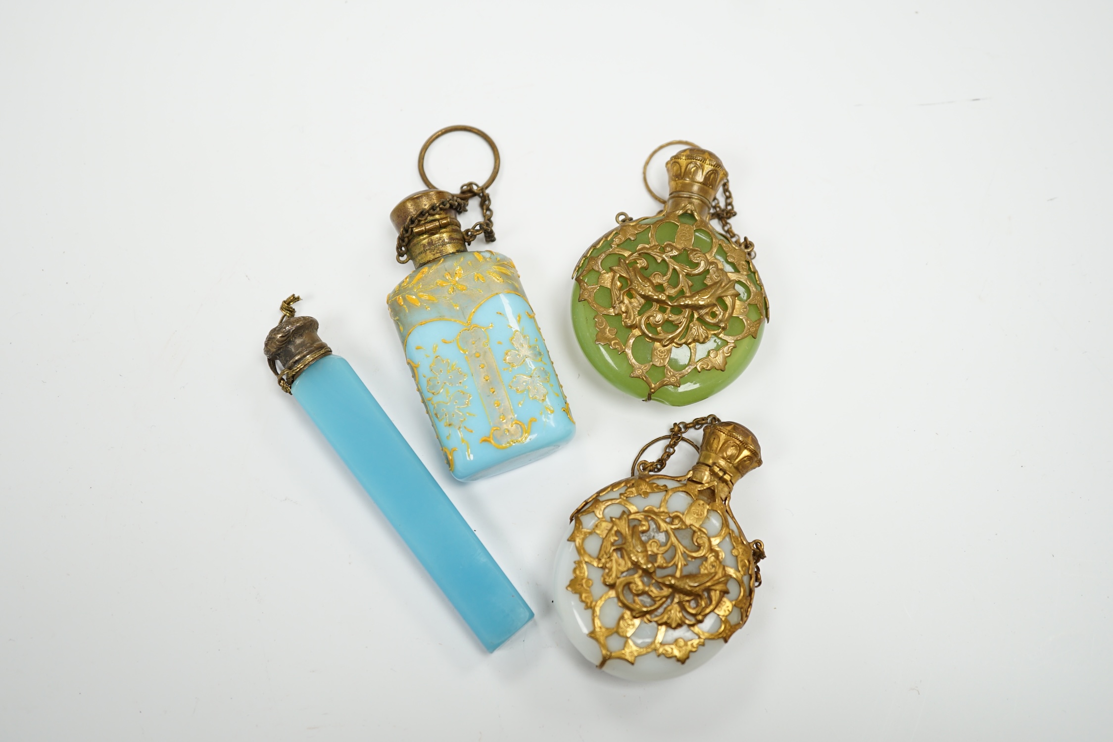 A group of four glass scent bottles with gilt metal mounts, largest 9cm high